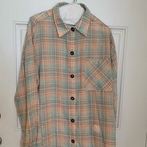 Lightweight plaid flannel-like button-up shirt.  Pastel oranges, greens & tans.